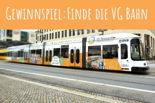 Die VG Bahn unter orangenem Banner mit Text "Gewinnspiel: Finde die VG Bahn"